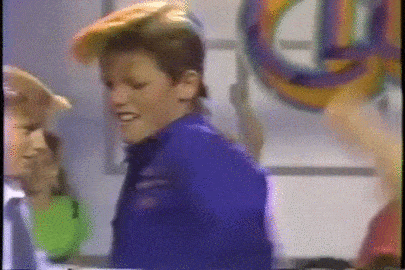Meme gif. Blonde boy Duane from Barbie Dance Club movie doing a Soul Train-like dance down a line of other kids. 