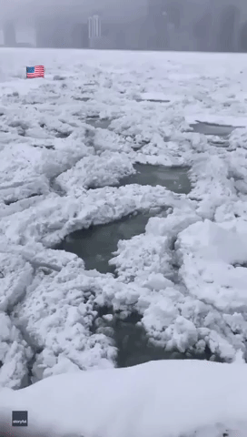 Snow and Ice Float Atop Lake Michigan After 10 Inches of Snow Falls on Chicago