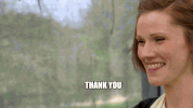 Reality TV gif. Cathryn Dresser on Great British Baking Show smiles wide and says "thank you, thank you," which appears as text.