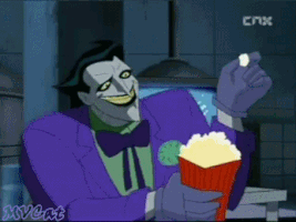 Cartoon gif. Joker from Batman: The Animated Series. He looks gleeful as he holds a bucket of popcorn and tosses a kernel into his mouth.