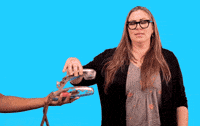 Video gif. A woman picks up a telephone that someone is holding out to her and screams violently into the receiver. Text, "No!"