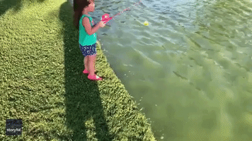 Father Teaches Daughter to Fish