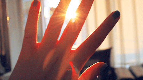 sun hand GIF
