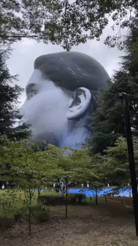 Giant Floating Head Raised Above Tokyo Park