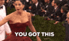 Celebrity gif. An excited Sarah Silverman on the red carpet points and smiles. Text, “You got this.”