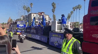 Confetti Showers Rams Championship Buses Near Los Angeles Memorial Coliseum