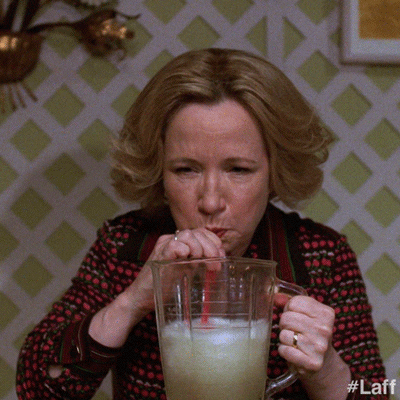 TV gif. Debra Jo Rupp as Kitty Foreman in That's 70s Show. She steadily drinks a margarita from a pitcher and we see the liquid go down as the straw twitches when she continues to chug.
