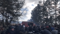 Migrants Crowd Around Van as Aid Distributed at Poland-Belarus Border