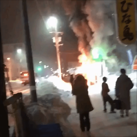 Bystanders Watch Fire at Sapporo Welfare Facility