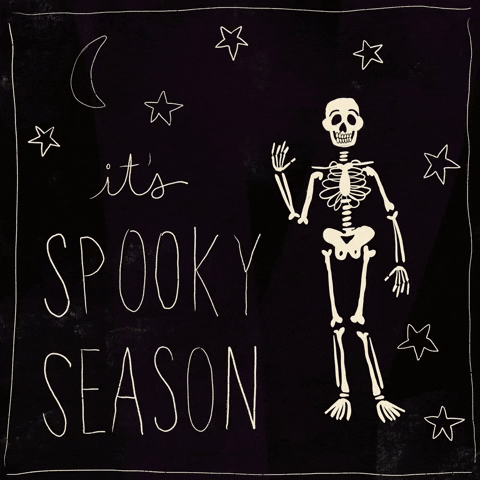 Digital art gif. Cartoon skeleton drawn onto a black background with stars and a moon waves at us. Text, reads “It’s spooky season."