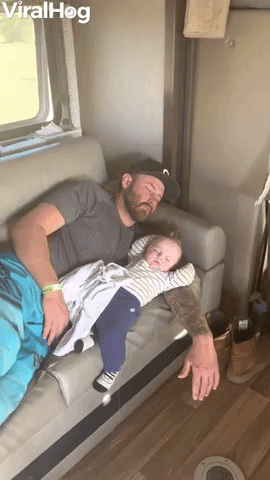 Baby Tries to Bail From Couch Nap With Dad