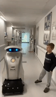 Hospital Cleaning Robot Shares a Joke With Young Patient