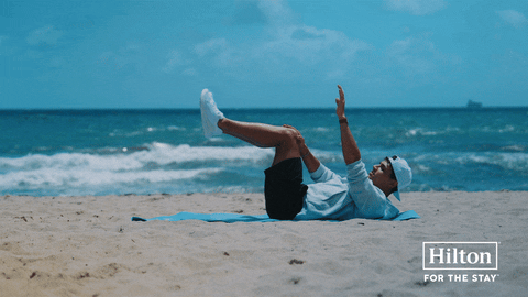 Lando Norris Beach GIF by Hilton Hotels