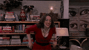 TV gif. Kat Dennings as Max Black from 2 Broke Girls wears a festive red dress, which doesn't hide her armpit stains very well. She raises her arms in celebration but quickly notices her sweaty armpits and sets them down.