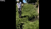 Man Tries to Jump Small Stream on Unicycle