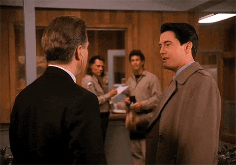 TV gif. Kyle MacLachlan as Dale Cooper on Twin Peaks gives a big thumbs up to David Lynch as Gordon Cole who gives a thumbs up back. Text, “GFFF.”