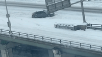Car Spins Its Wheels as Heavy Snow Strands Vehicles in Southern Ontario