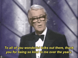 Celebrity gif. Jimmy Stewart at the Academy Awards in 1985, wearing a tux and speaking into a microphone. Text, "To all of you wonderful folks out there, thank you for being so kind to me over the years."