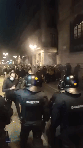 Riot Police Clash With Protesters Amid Anti-Lockdown Unrest in Barcelona
