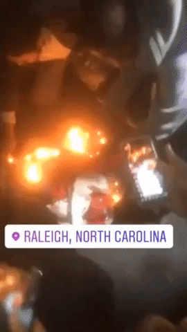 Protesters Burn Flags in Raleigh After Man Shot by Police Officer