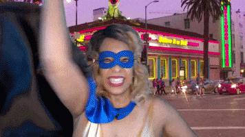 ComedianHollyLogan mask superhero fighting costume GIF