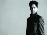 Celebrity gif. The artist formerly known as Prince walks across the frame shaking their head in disgust.