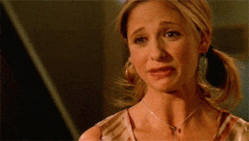 TV gif. Sarah Michelle Gellar as Buffy in Buffy The Vampire Slayer looks over at someone with tearful eyes and a sad frown. She nods her head, then covers her eyes with a tissue that’s in her hand, and sobs into it.