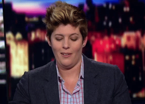 Political gif. Sally Kohn looks at us and purses her lips before raising her eyebrows skeptically.
