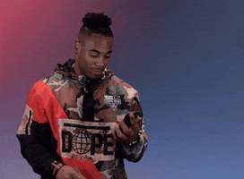 Sports gif. Rashad Jennings from the NFL looks down at his phone before looking back at up us with a wide eyed, clear expression and says, "Noted!" with a big nod and resumes scrolling on his phone.