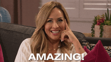 Reality TV gif. Clare Crawley on The Bachelorette puts a finger on her cheek and says, "Amazing!"