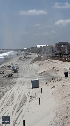 Dust Devil Whips Towels Into Air on South Carolina Beach