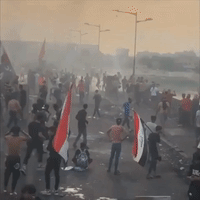 Tear Gas Deployed as Protesters Gather on Key Bridges in Central Baghdad