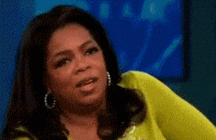 Celebrity gif. Oprah Winfrey shakes her head, looking annoyed as if to say, “no.”