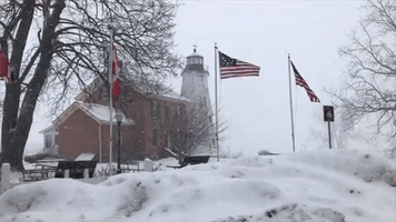 Snow Falls in Rochester as Wind Churns Icy Lake Ontario