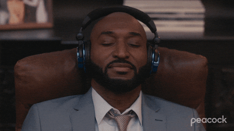 A man is listening to music with headphones on.