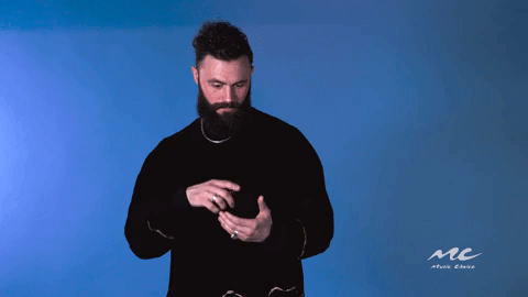 Celebrity gif. Mikky Ekko pretends to type something on a phone and then reacts with a surprised “ooooh.”
