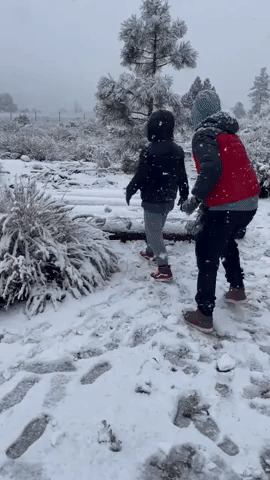 Kids Play in Freshly Fallen Snow Amid Winter Storm Warning