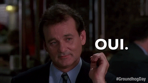 Movie gif. Bill Murray as Phil in Groundhog Day looking suave and flirting as he nods and says, in French, "oui."