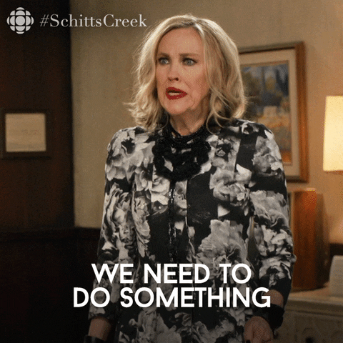 TV gif. Catherine O’Hara as Moira Rose on Schitt's Creek looks around with a worried, frantic look in her eyes as she says, “We need to do something.”