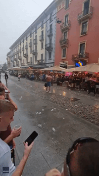 Newcastle Fans Slide on Wet Pavement Ahead of Champions League Tie in Rain-Soaked Milan