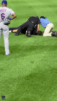 Starling Marte Watches as Security Tackles Invader