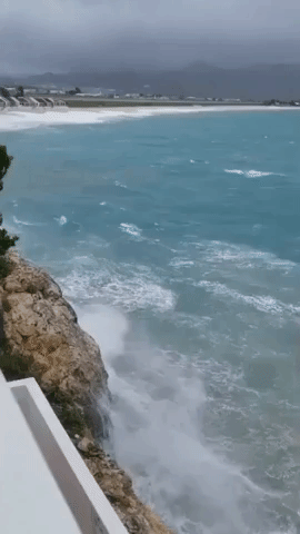 Rough Surf Crashes Onto Cliffs in St Maarten During Tropical Storm Warnings