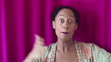 Celebrity gif. Tracee Ellis Ross stands in front of a magenta curtain. She looks at us with wide eyes as she pats her chest and points at us. She says, “Me, you.”