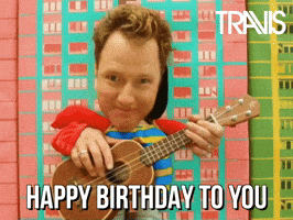 Video gif. Man with his head and hands coming out of a cutout box that makes him look like a toddler plays a ukulele. Text, "Happy Birthday to you."