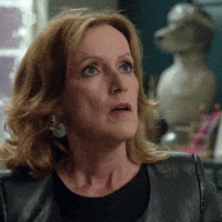 Movie gif. Kadèr Gürbüz as Karin Baert in Thuis. She looks shocked and annoyed as she stares at someone before rolling her head around and sighing, dropping her hand on her lap.