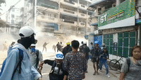 Yangon Protesters Throw Molotov Cocktails Over Barricade