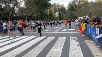 NYC Marathon Runners Celebrate With Crowds as They Approach Finish Line