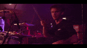 Mindblind leon grin drumming mindblind GIF