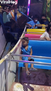Child Just Chills on Amusement Park Ride   