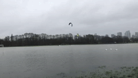 Kite Surfers Have Fun on Flooded Football Pitch in Paris Park